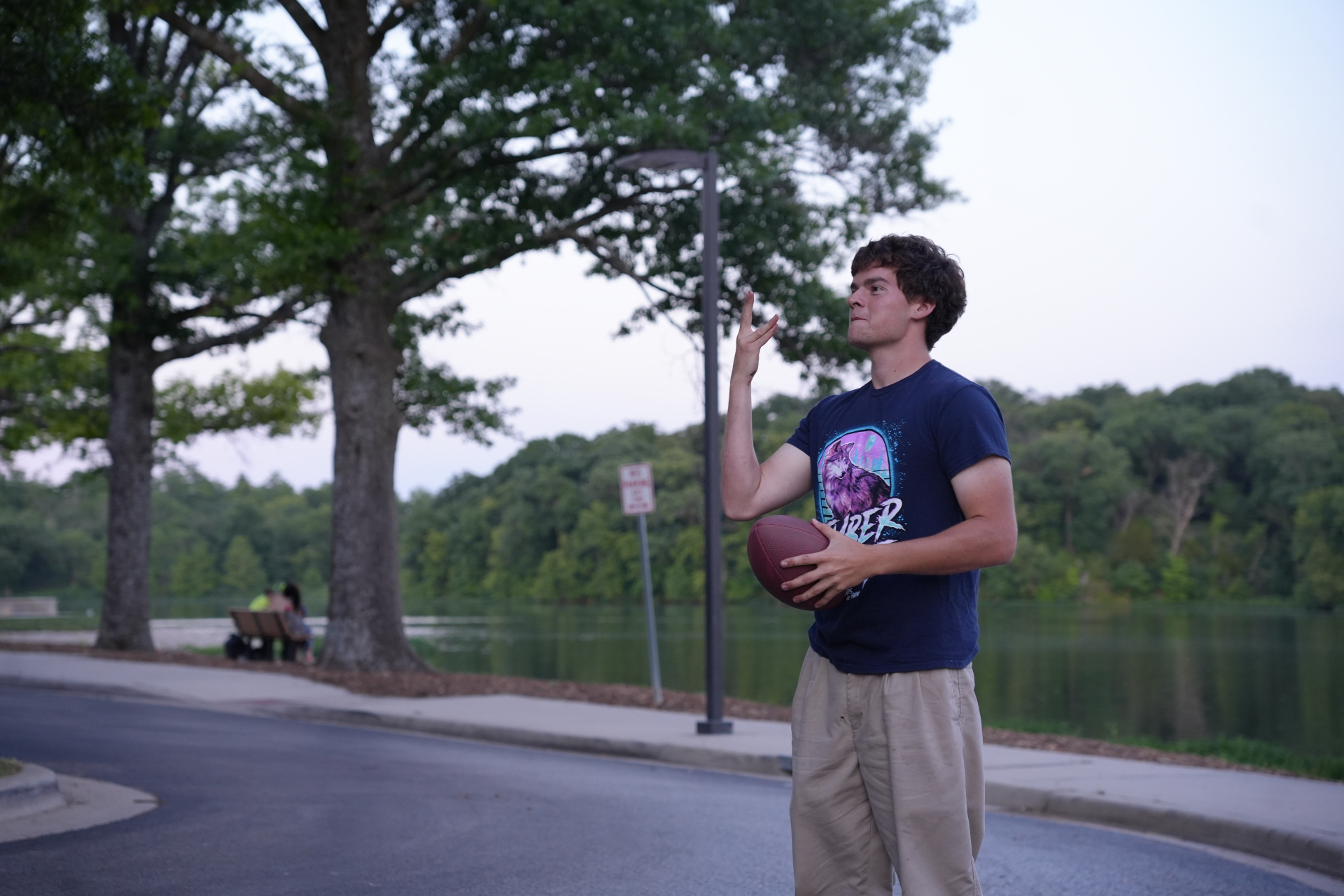 Alex Allee, owner of Bluestem Land Management, outdoors by a lake